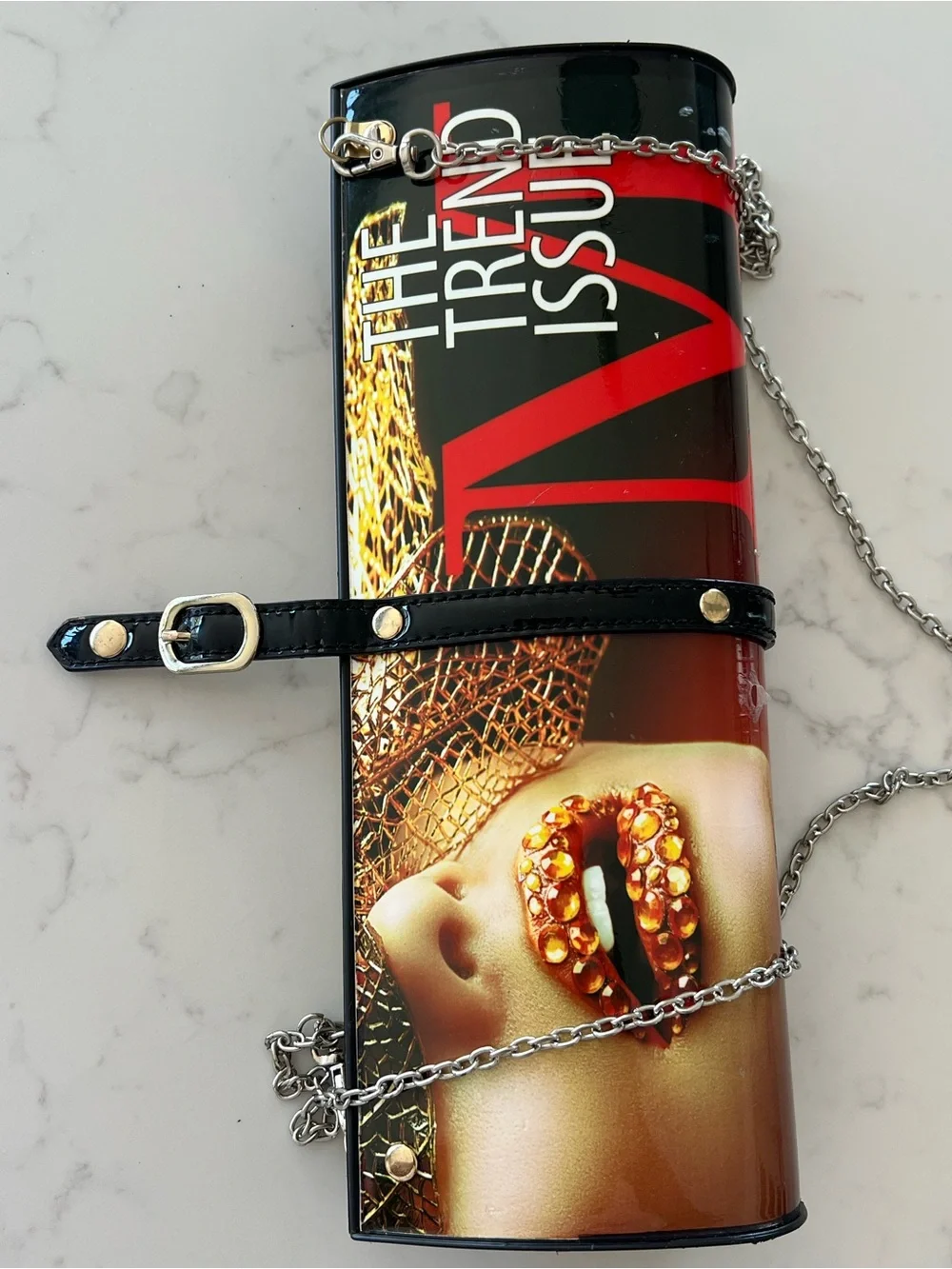 Edgy 80s rolled magazine clutch hard case with crossbody chain red and black